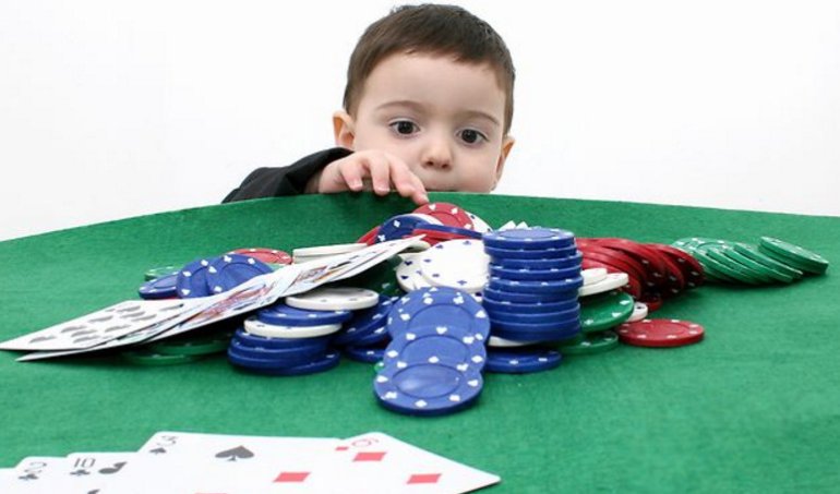 A child with Cards and Casino Chips